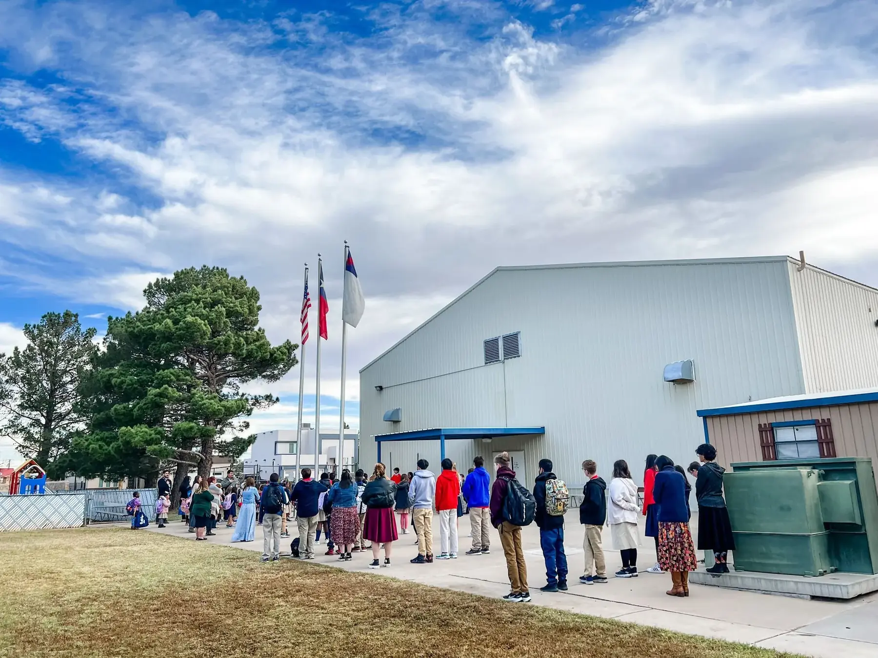 NECA students start each day with prayer and pledges as a community.
